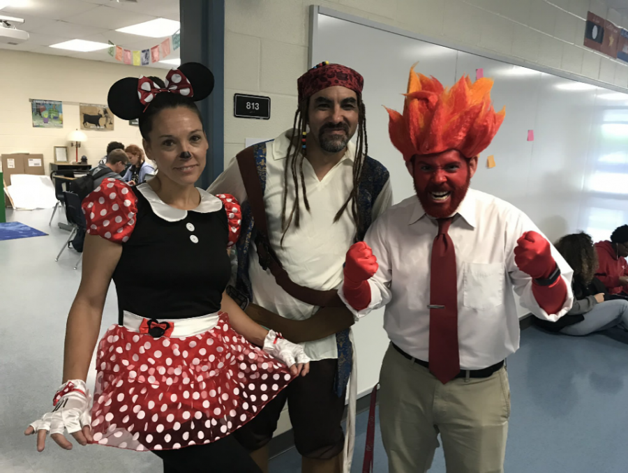 Left to right: Spanish teacher Ms. Perez-Bonet, Spanish teacher Mr. O'Neil, and English teacher Mr. Mosley, dressed up for Disney Day during Spirit Week 2018. 