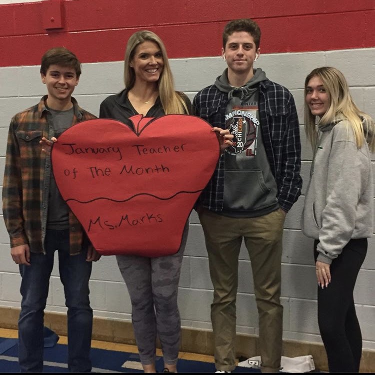 Ms. Marks pictured with members of the SCA for Januarys Teacher of the Month.