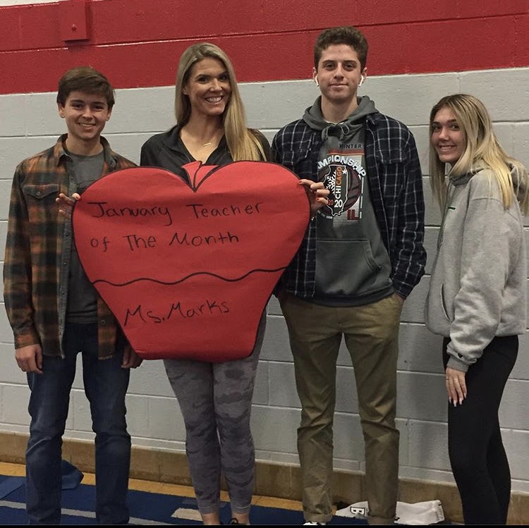 Ms. Marks pictured with members of the SCA for January's Teacher of the Month.