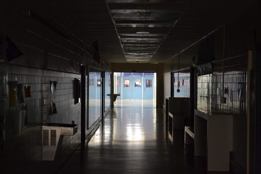 
The empty 100 hallway with the lights turned off during a weekend.
