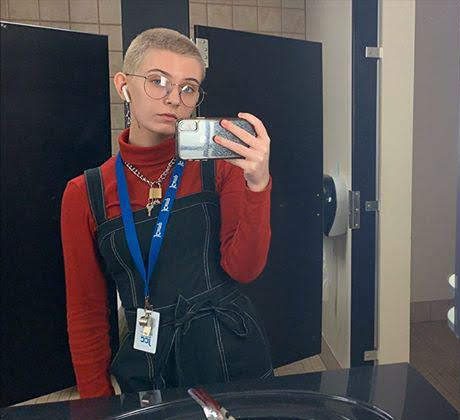 Abigail Knights, senior, wearing a lock and key as a necklace at her place of work, a daycare.  Photo via her Instagram, @abbyknightess.