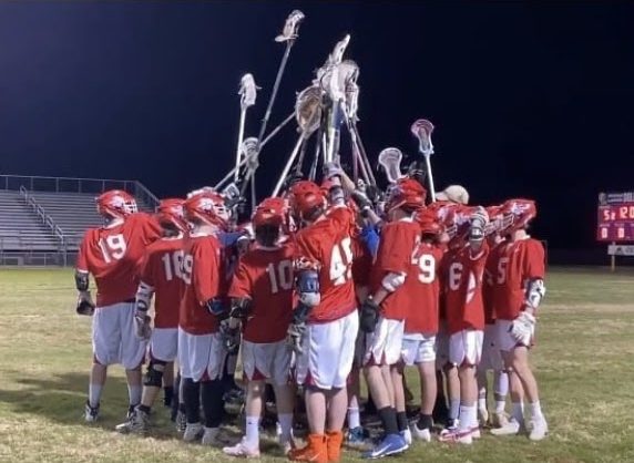 A lively moment as the boys lacrosse team huddled together after a difficult game against Ocean Lakes.